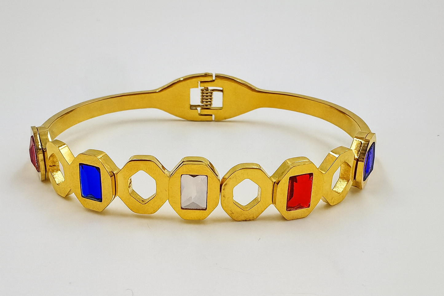 Geometric Gold-Plated Bracelet with Red, Blue & White Stones – Modern Statement Jewelry