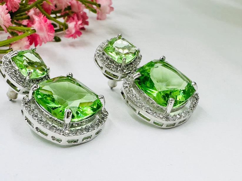 ELEGANT GREEN GLASS STONE AND AD STUDDED EARRING