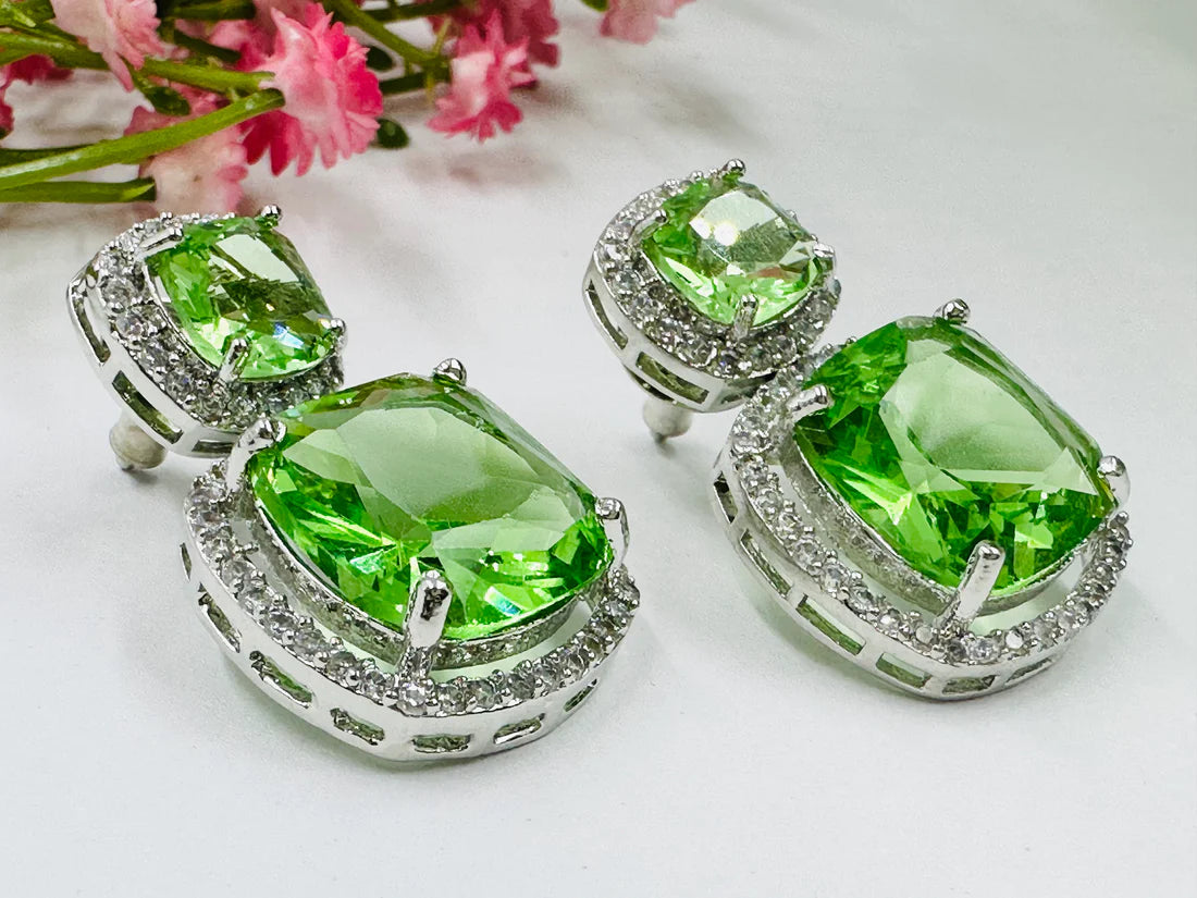 ELEGANT GREEN GLASS STONE AND AD STUDDED EARRING