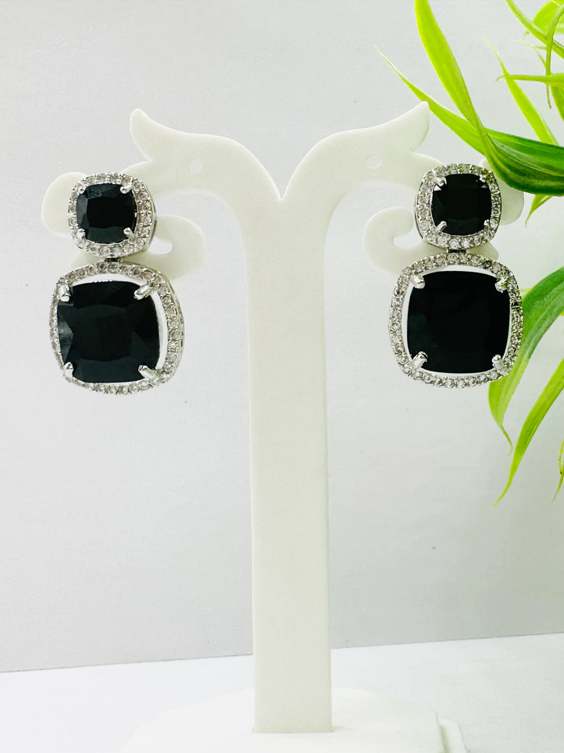 ELEGANT BLACK GLASS STONE AND AD STUDDED EARRING