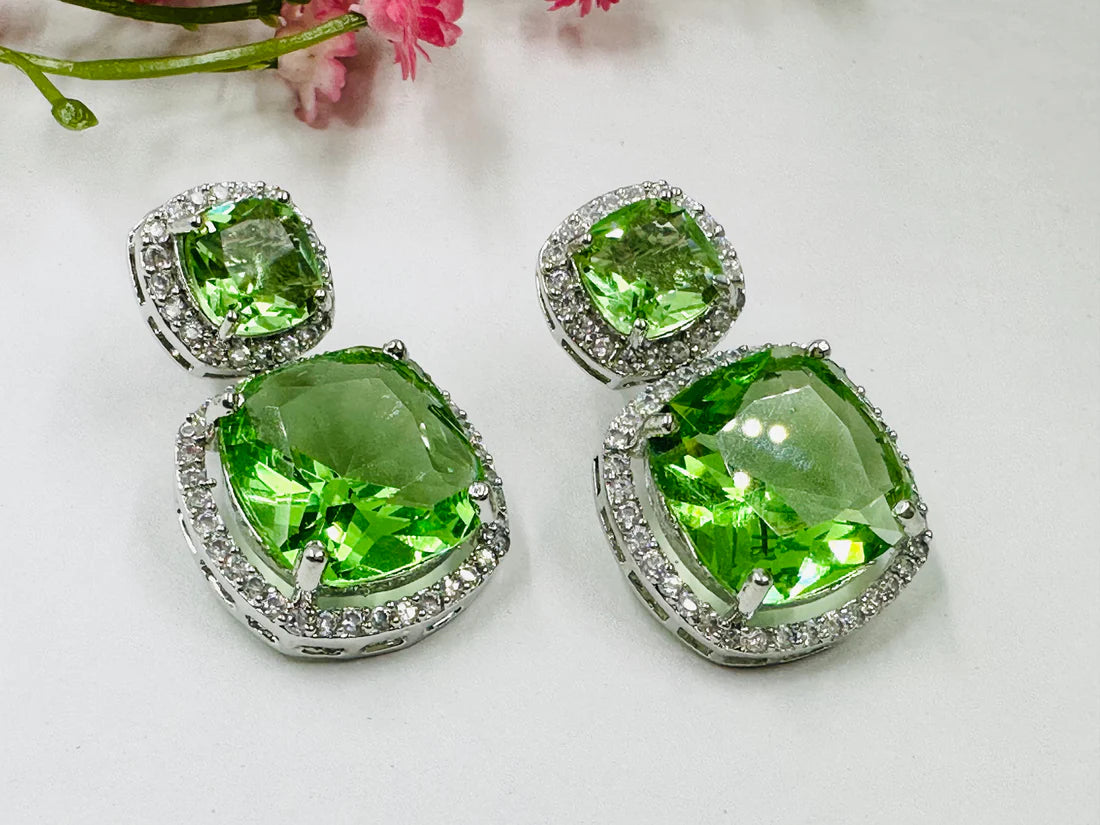 ELEGANT GREEN GLASS STONE AND AD STUDDED EARRING
