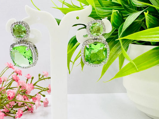 ELEGANT GREEN GLASS STONE AND AD STUDDED EARRING